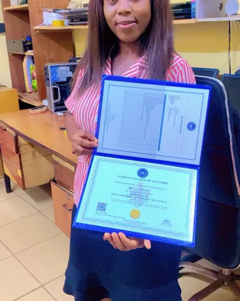 London College of Teachers graduate holding her teacher training diploma and transcript